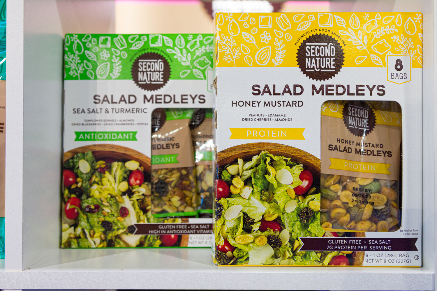 Two boxes of Second Nature Salad Medleys, Sea Salt and Turmeric and Honey Mustard.