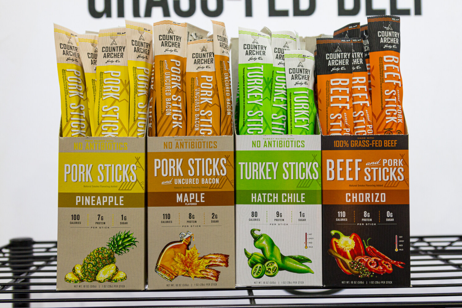 Four boxes of Country Archer meat sticks in pineapple, maple, hatch chile and chorizo flavors.