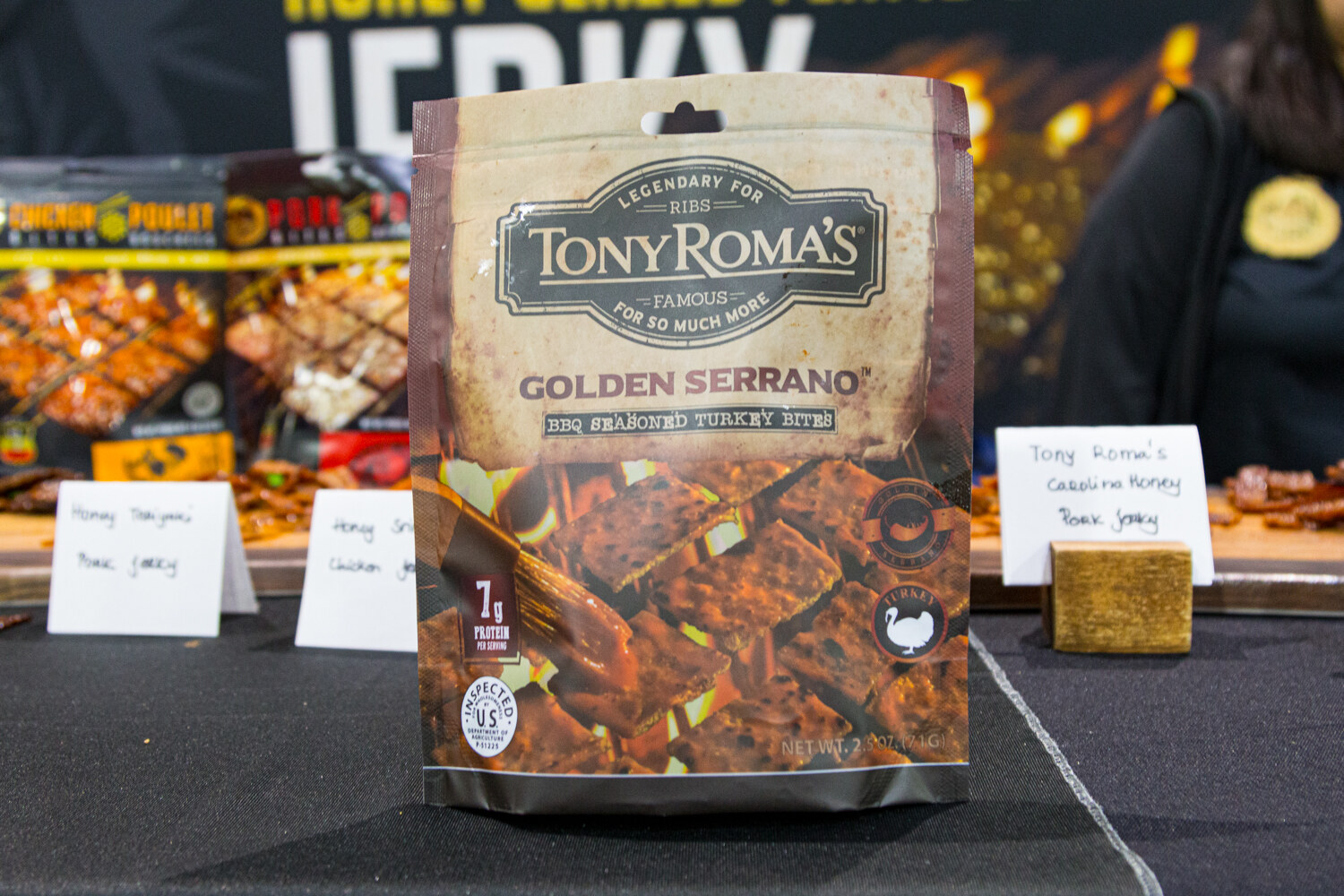 A Tony Roma's pouch of barbecue seasoned turkey bites with small tasting-sign cards.