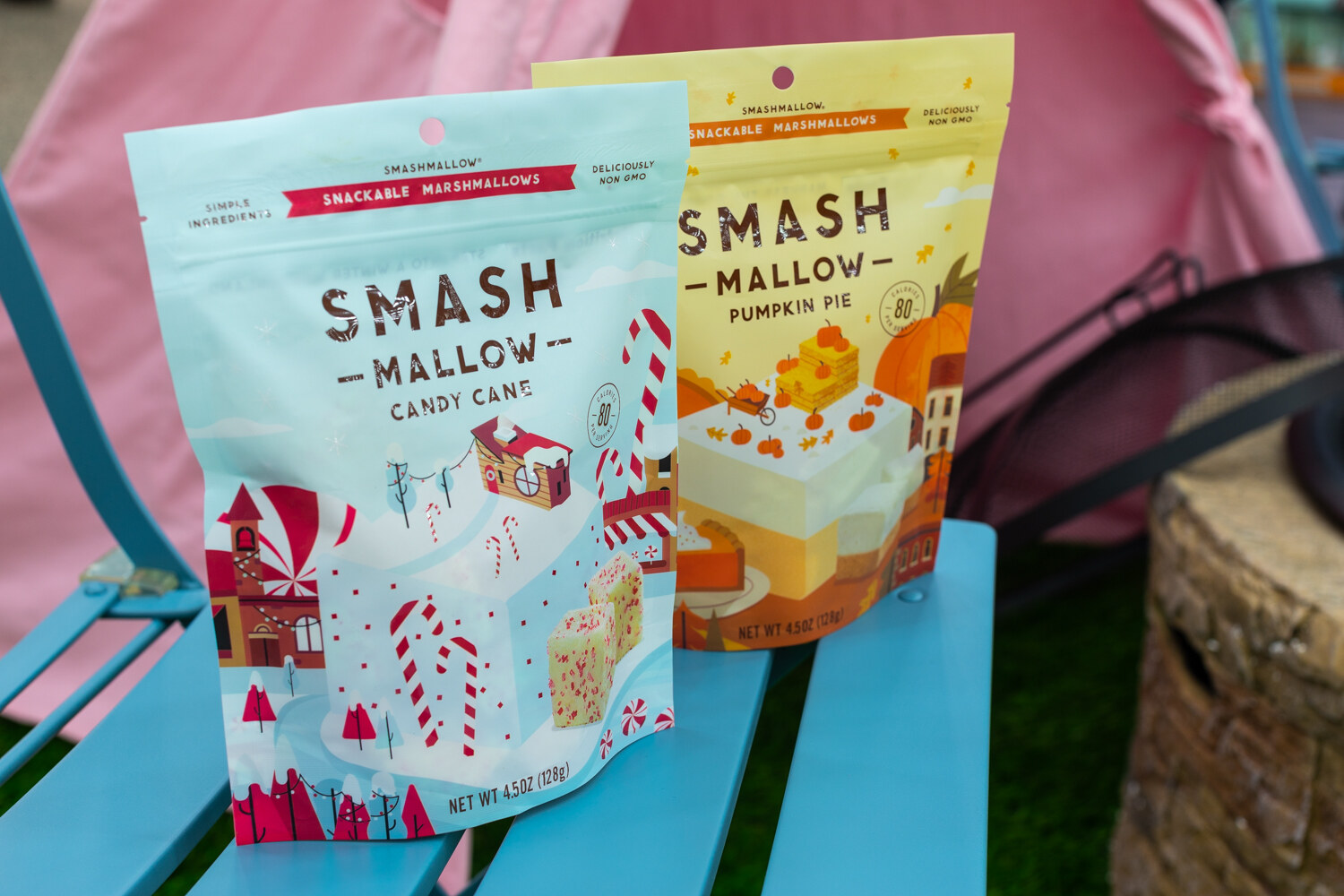 Two bags of Smashmallow marshmallows on a turquoise bench.