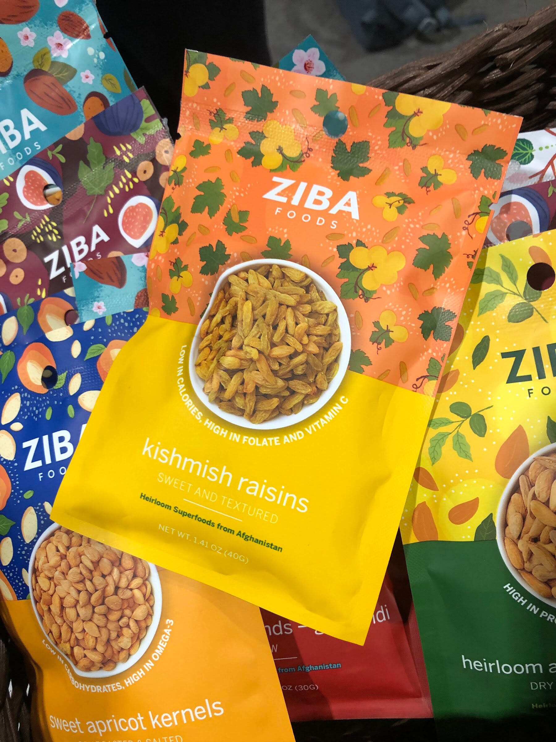 A Ziba Foods kishmish raisins bag surrounded by other colorful Ziba packages in a basket