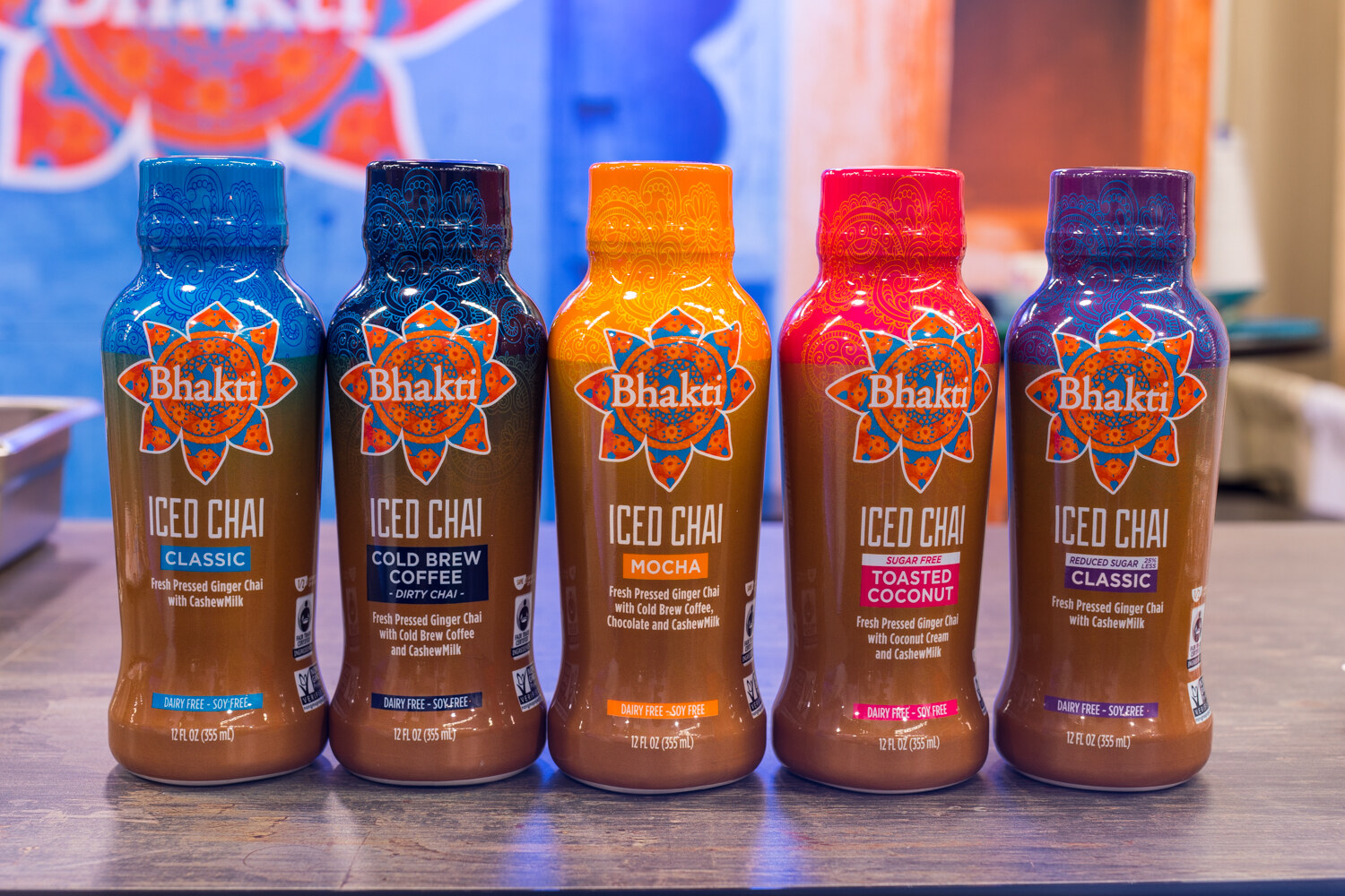Five Bhakti iced chai bottles in classic, cold brew coffee, mocha, toasted coconut and reduced sugar classic.