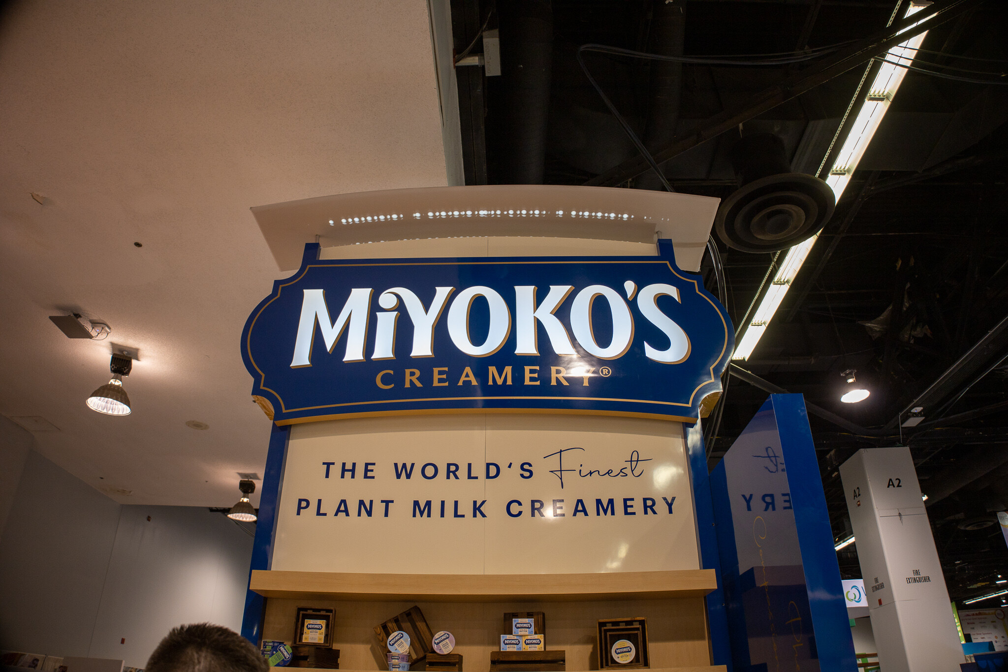 A Miyoko's Creamery sign reading The World's Finest Plant Milk Creamery overhead