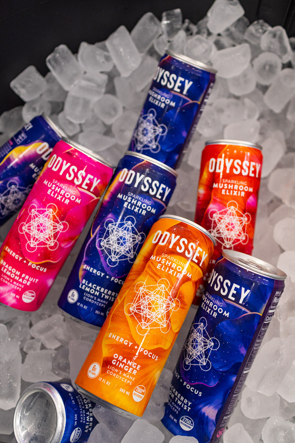 Colorful Odyssey cans resting on a bed of ice