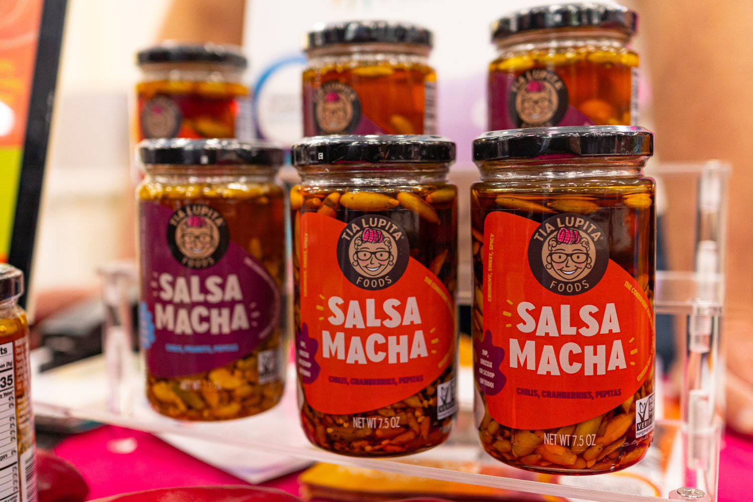 Three jars of Salsa Macha in oil on a display