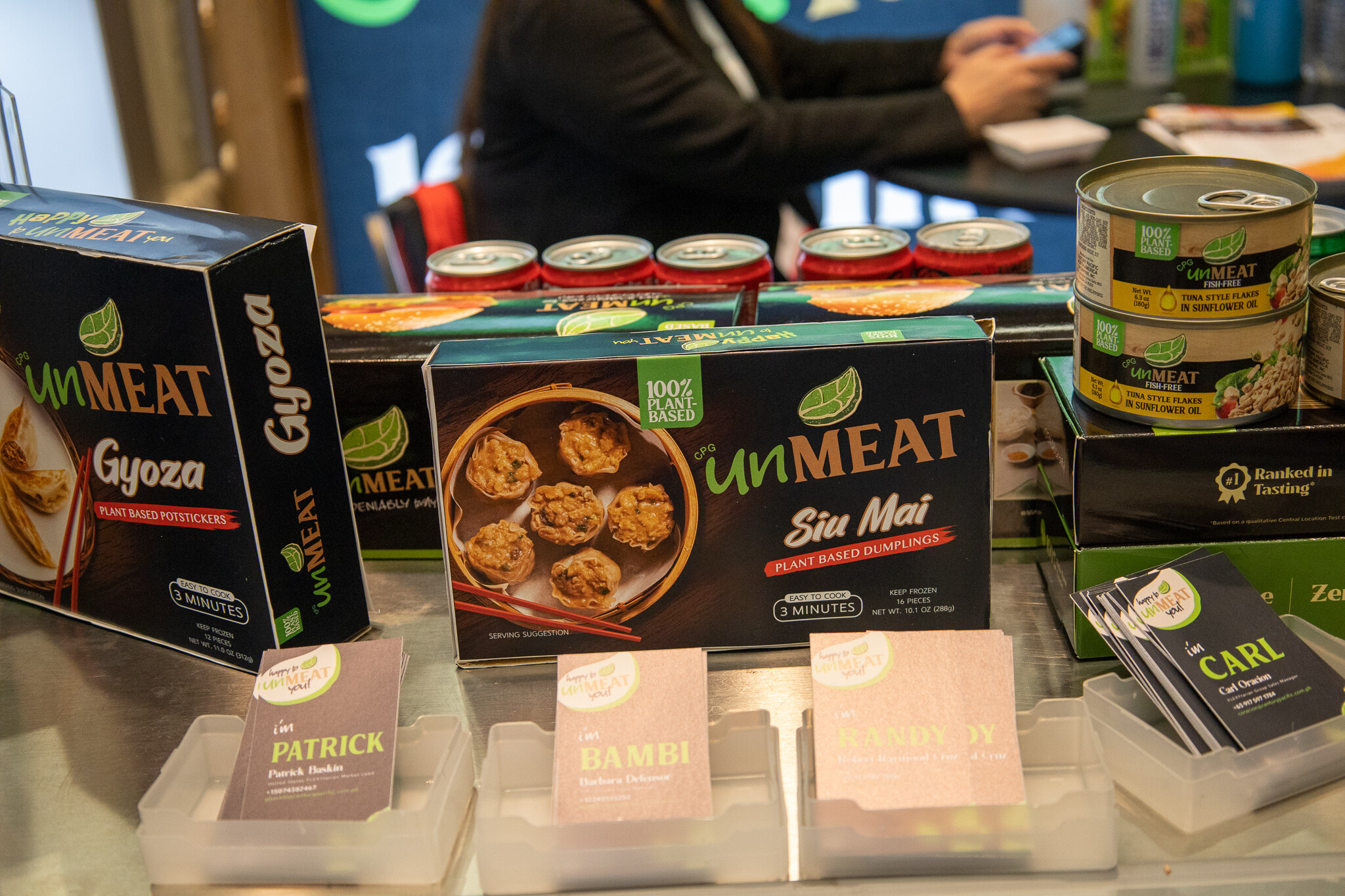 A display of unMeat canned plant-based meat and dumpling boxes