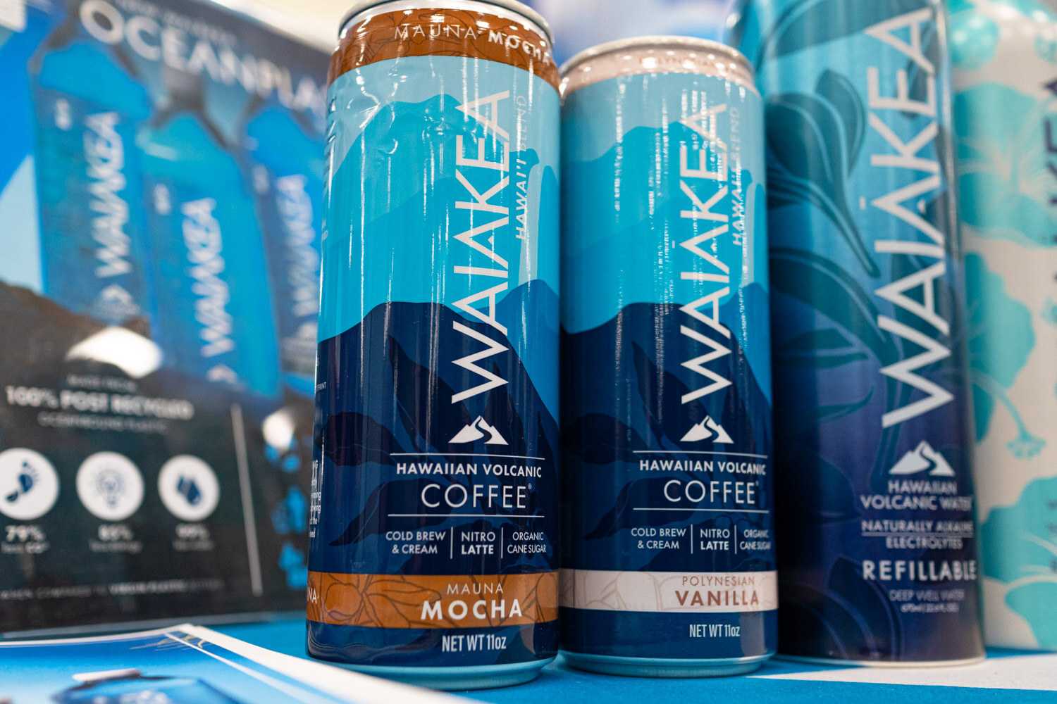 Three Waiakea Hawaiian volcanic coffee cans in mocha and vanilla flavors