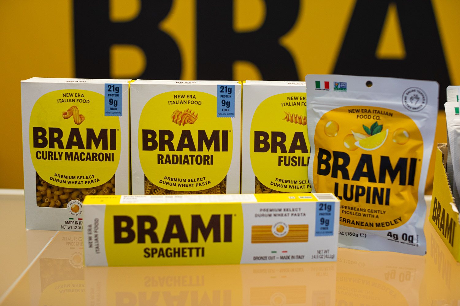 Boxes of Brami curly macaroni, radiatori, fusilli and spaghetti with Brami lupini snack bags