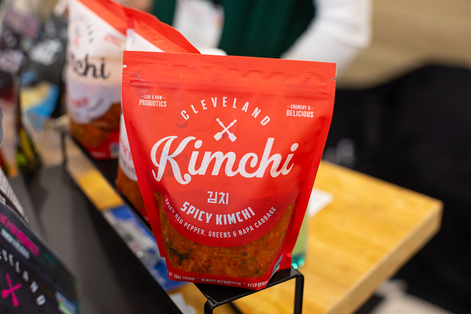 A bag of Cleveland Kimchi spicy kimchi on a stand