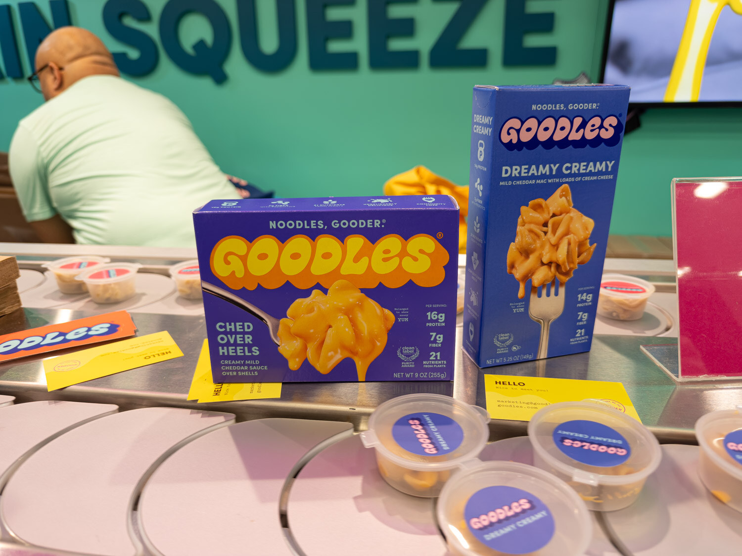 Boxes of Goodles Cheddar Chéer Heels and Dreamy Creamy mac and cheese with sample cups