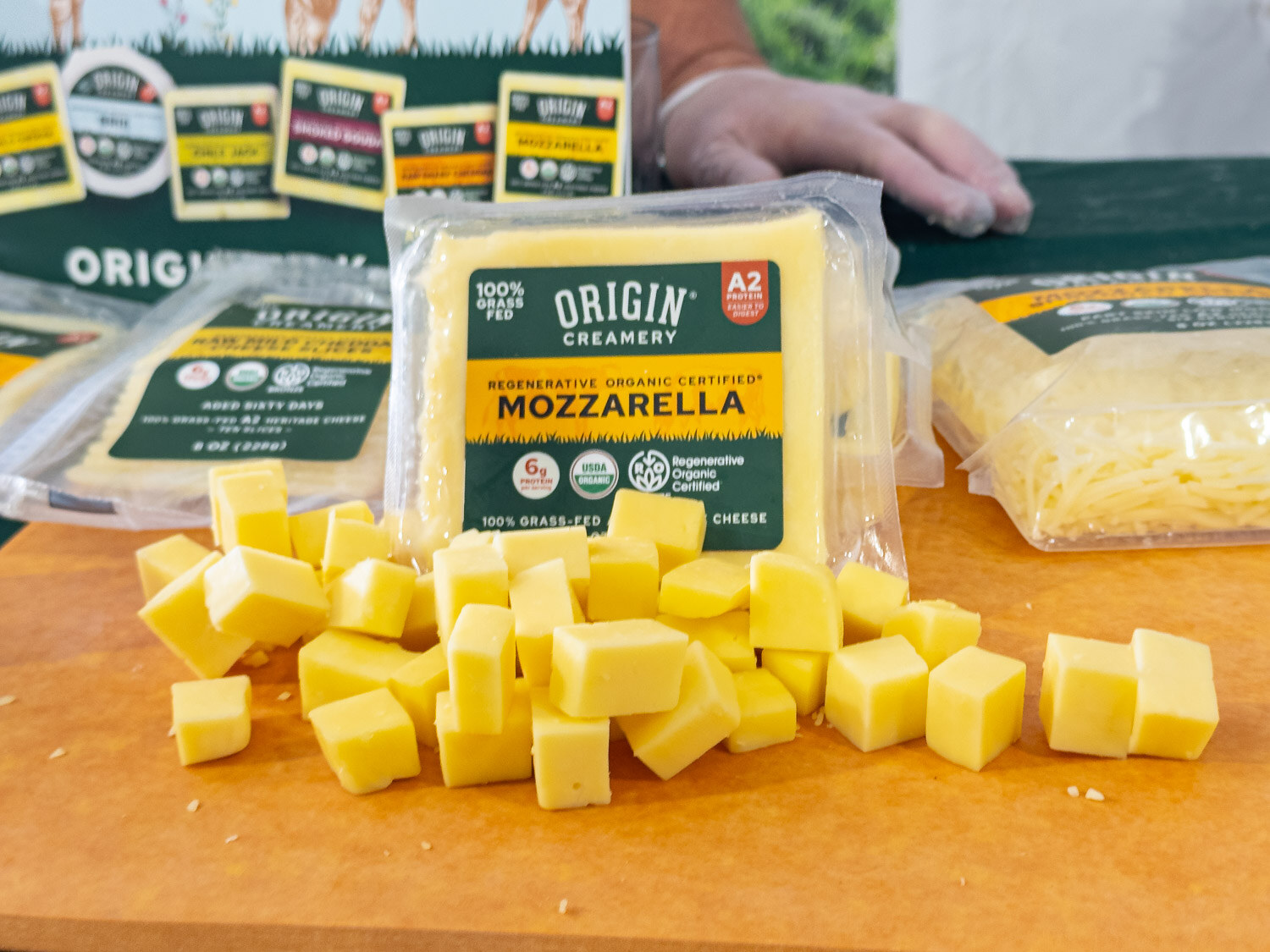 Origin Creamery mozzarella with cubed samples on a cutting board