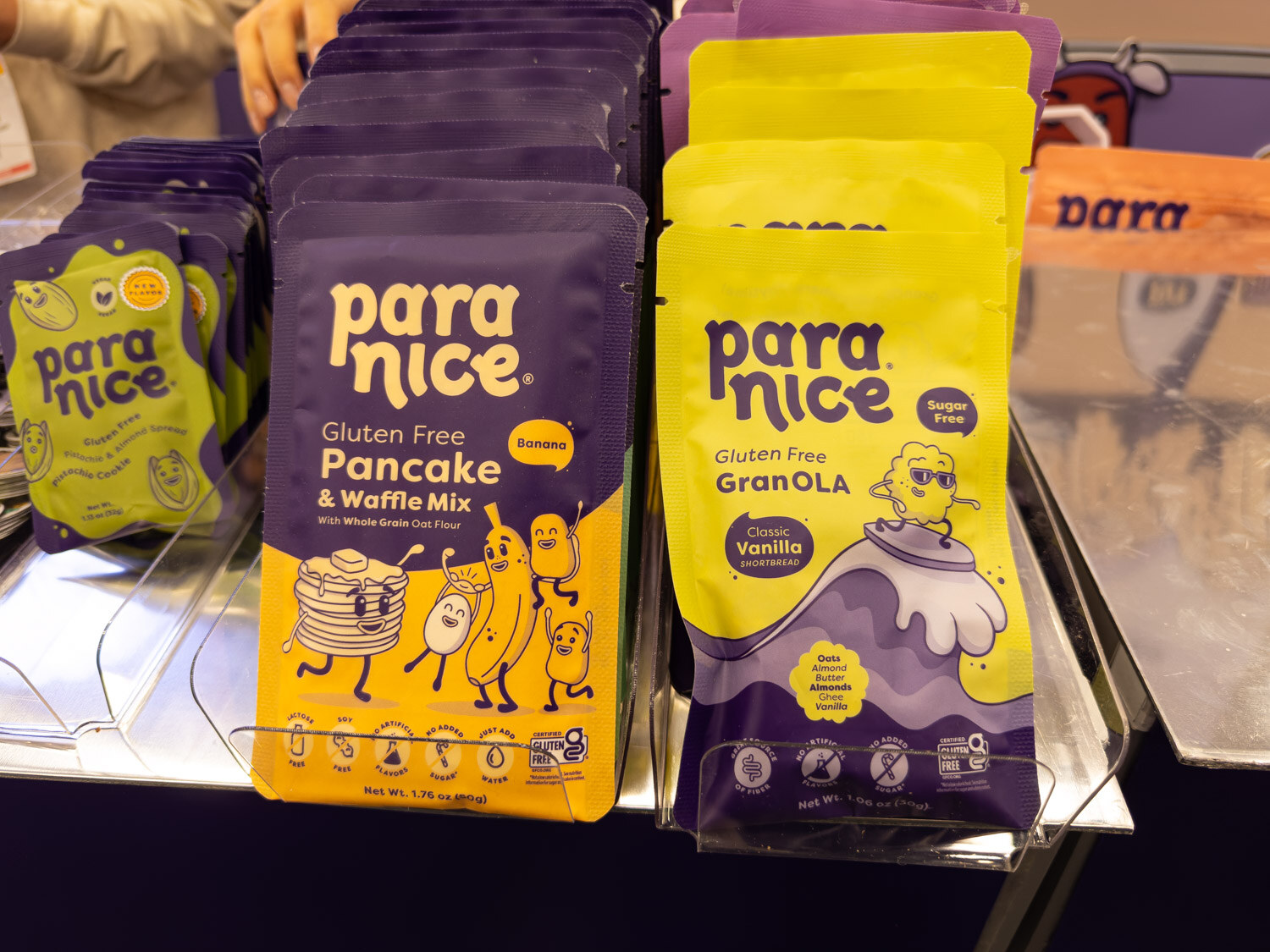 Bags of Paranice gluten free pancake and waffle mix and GranOLA on a table