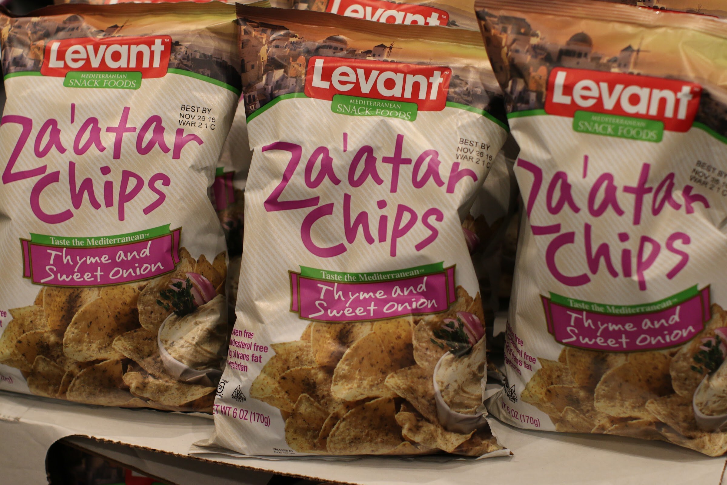Three bags of Levant Mediterranean Snack Foods Za'atar Chips, thyme and sweet onion.