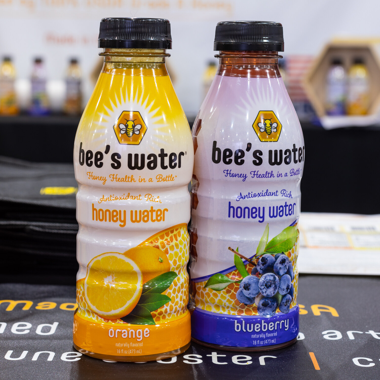 Two Bee's Water bottles on a table.