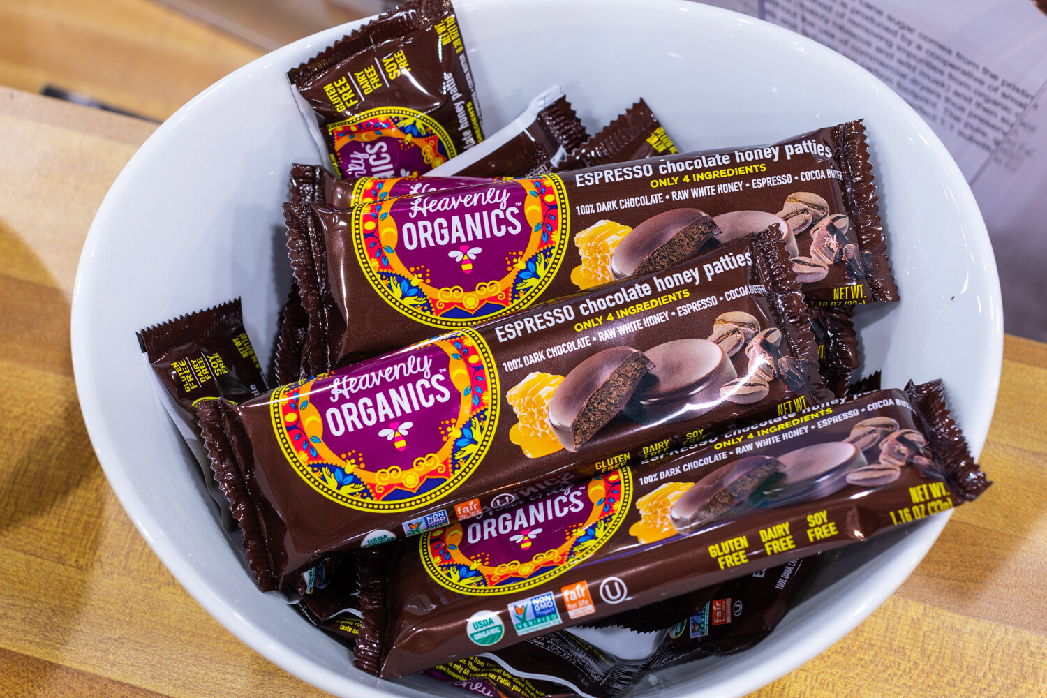 A white bowl of Heavenly Organics espresso chocolate honey patties.