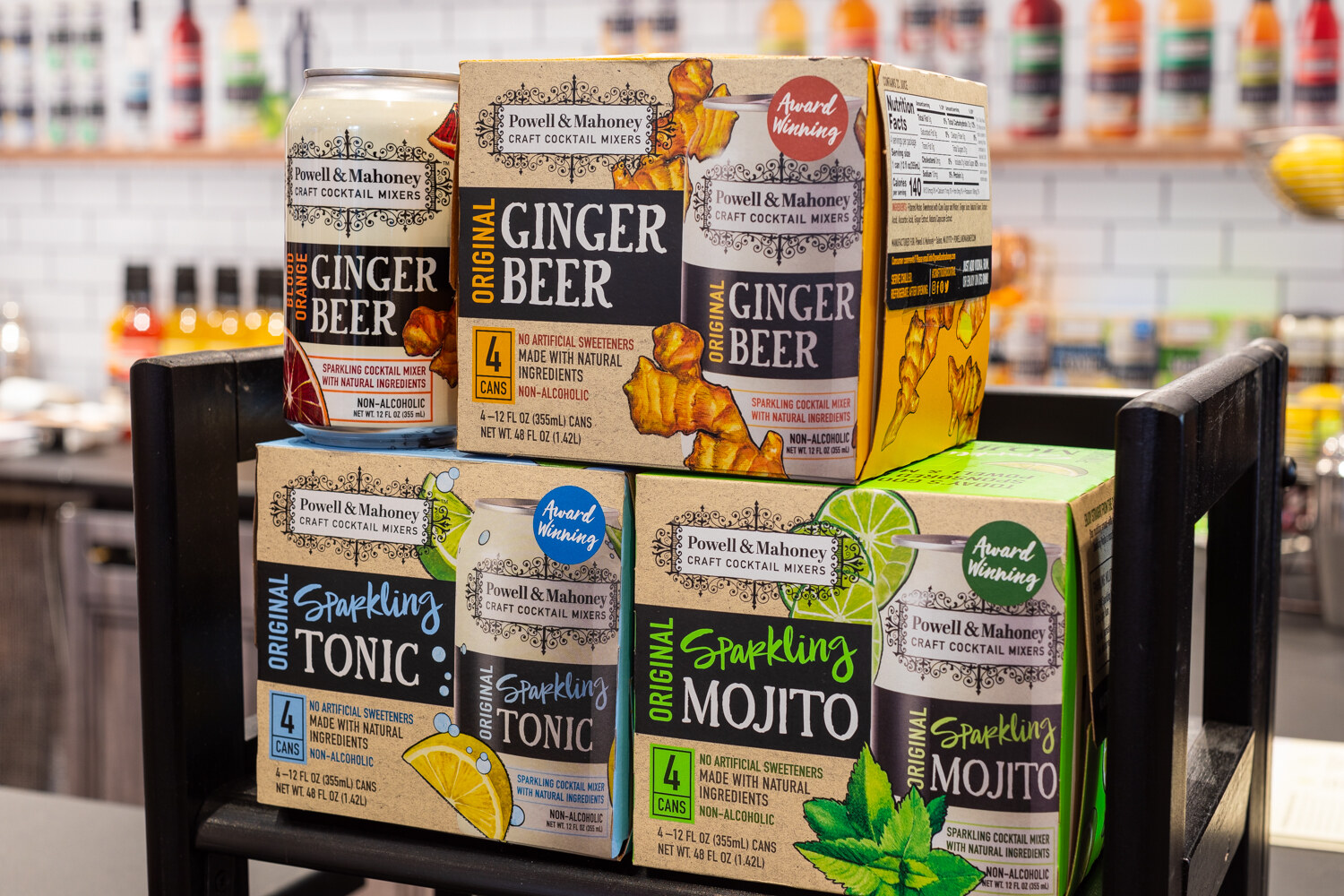 Boxes and a can of Powell & Mahoney craft cocktail mixers.