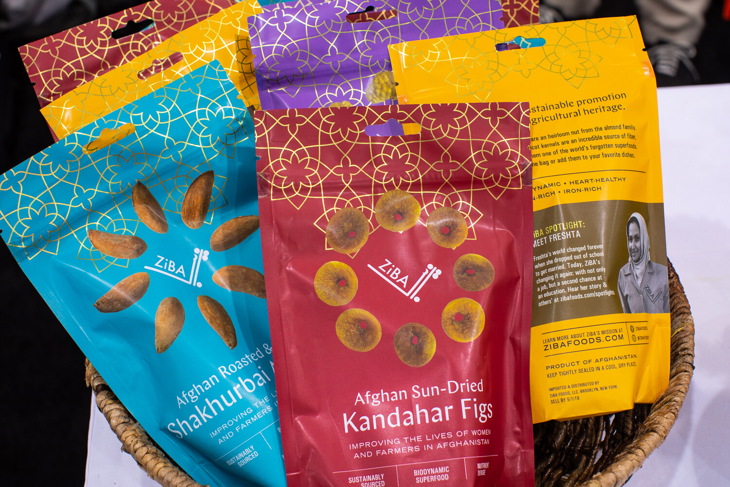 Bags of Ziba Kandahar figs and Shakhurbai almonds in a basket.