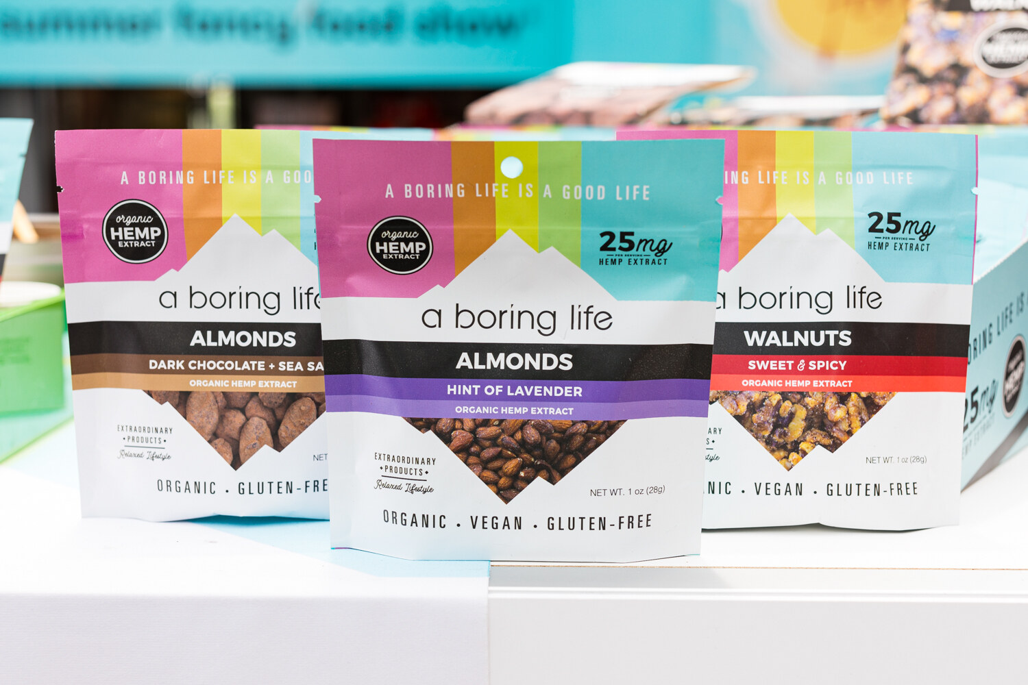Photo of A Boring Life hemp extract almonds and walnuts in bags.