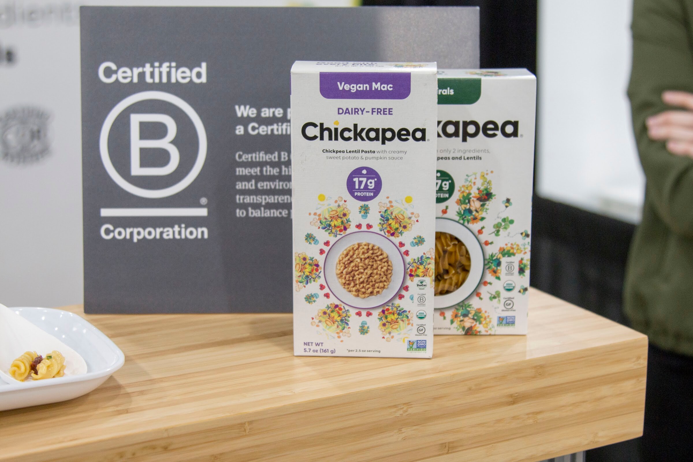 Photo of boxes of Chickapea pasta in front of a Certified B Corporation sign.