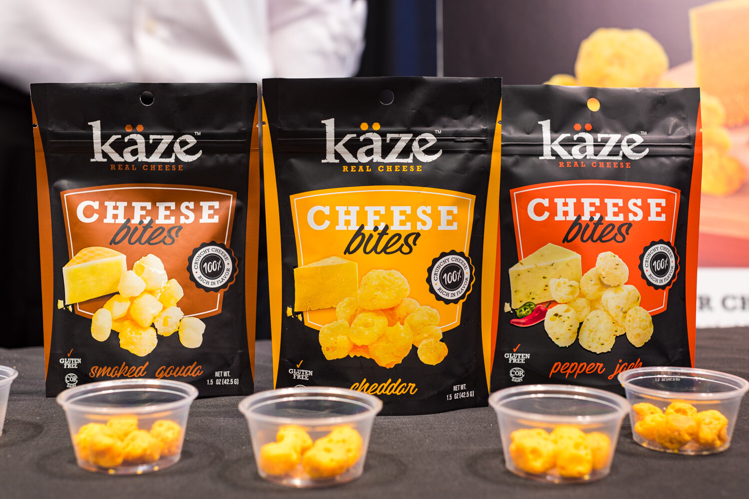 Photo of bags of Kaze cheese bites with sample cups.
