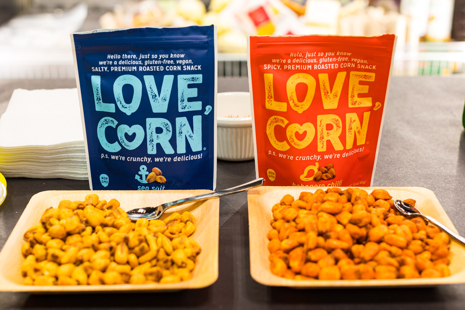Photo of bags and bowls of Love, Corn roasted corn snack.