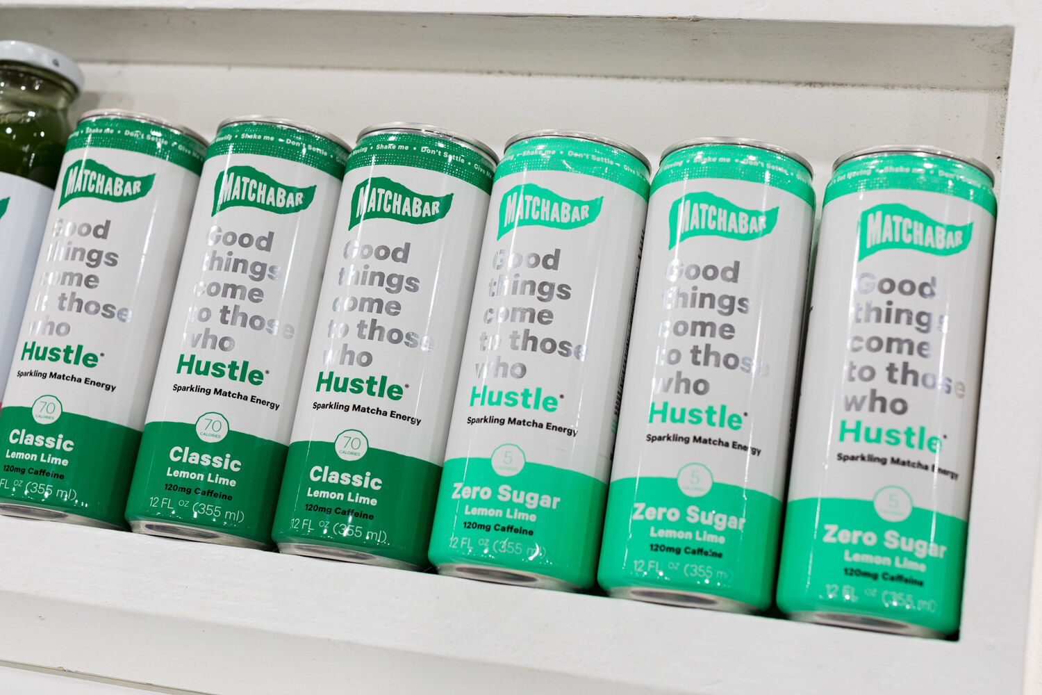 Photo of angled cans of Matchabar sparkling matcha energy drink.