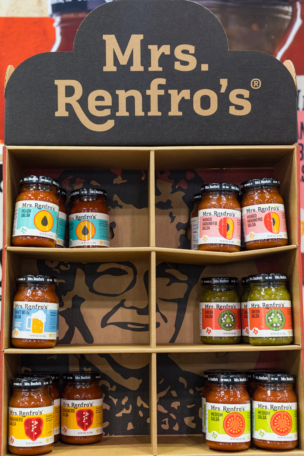 Photo of a Mrs. Renfro's display shelf of salsa jars.