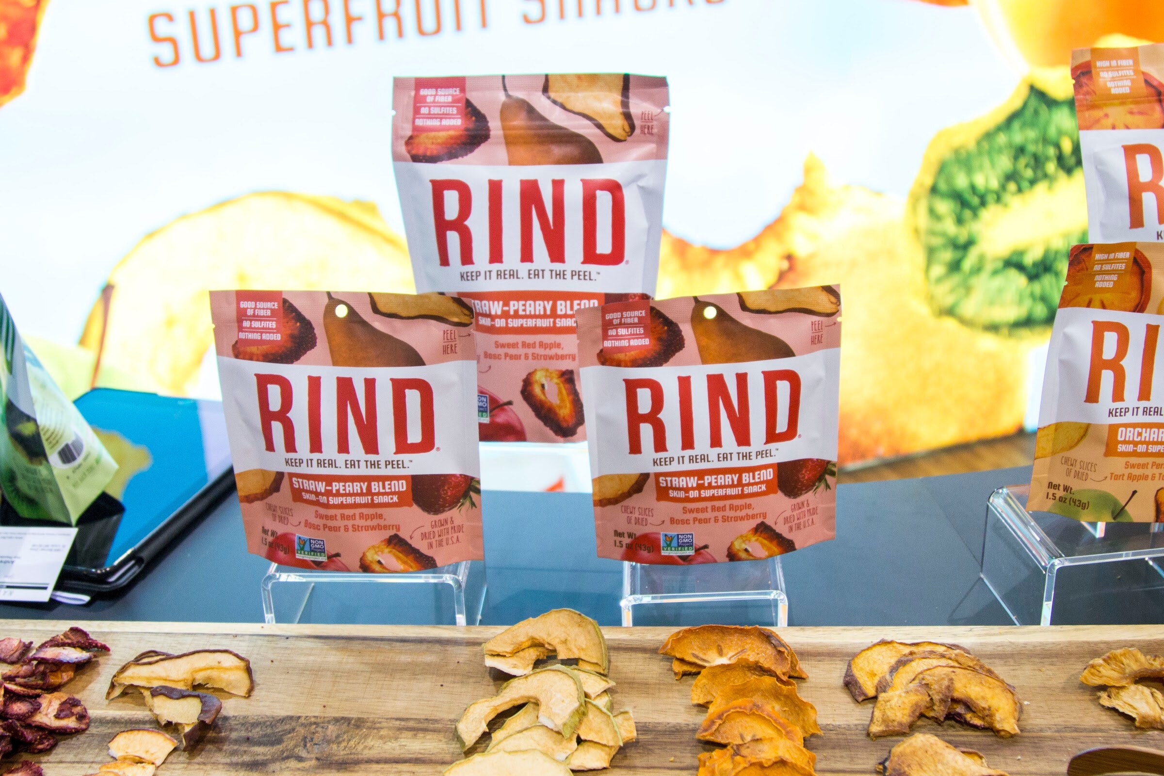 Photo of Rind dried fruit bags above a tray of dried apple slices.