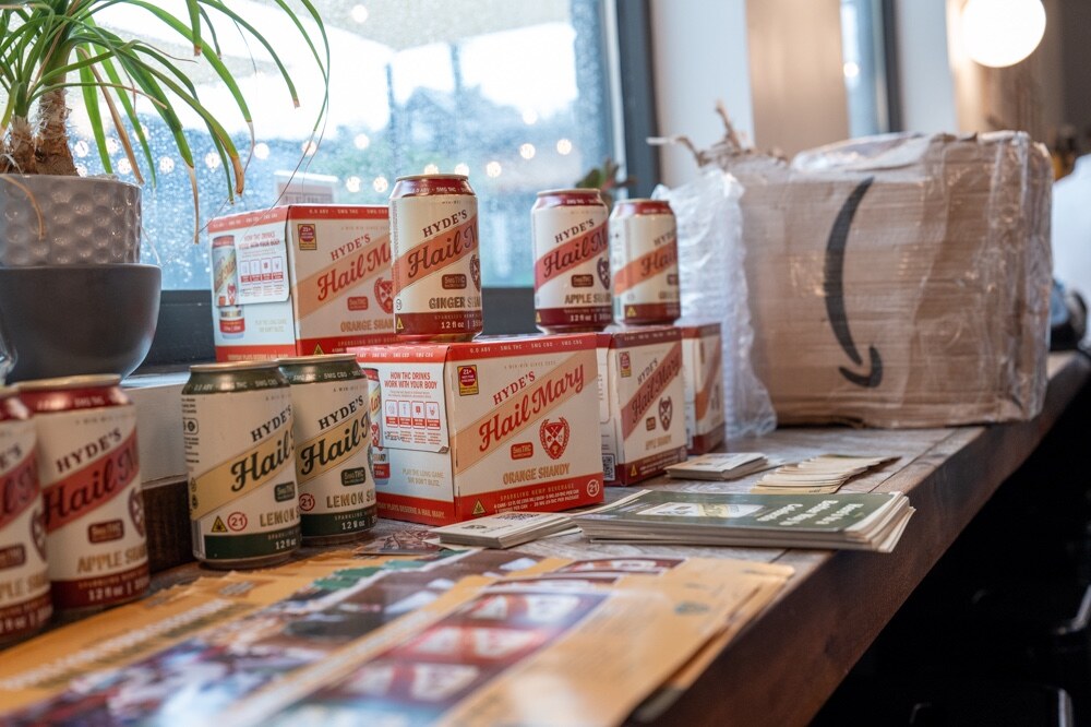 Cans and cases of Hyde’s Hail Mary lined up on a window ledge.